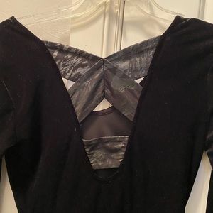 BCBGeneration black velvet dress with cross cross back detail. Size extra small